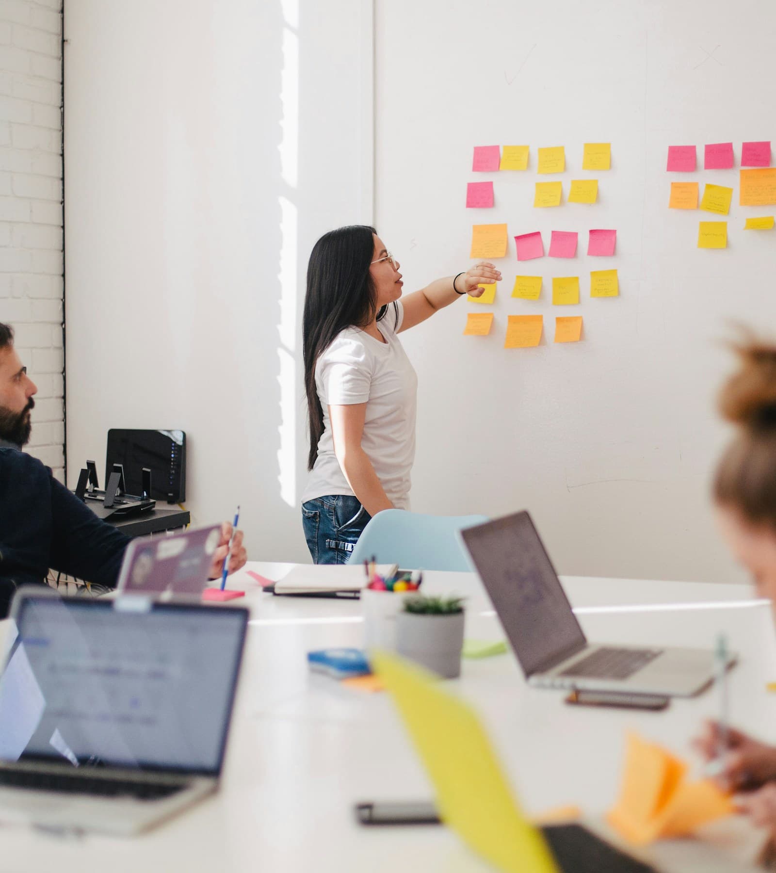 Professionals collaborating in a modern corporate meeting room
